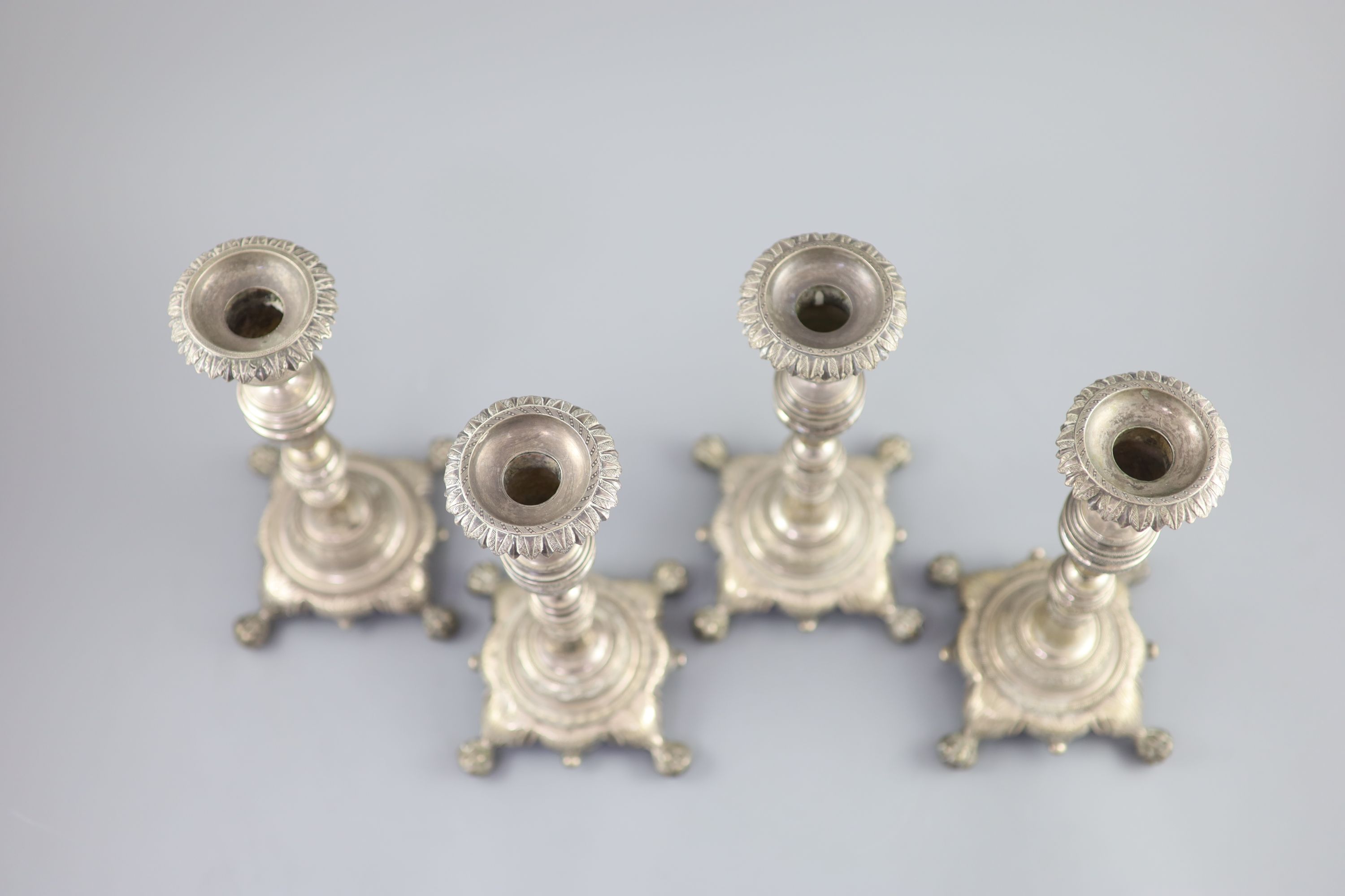 A set of four early 19th century South American? cast silver candlesticks